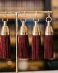 Granada Hotel Signature Tassel Keychain solid brass keychains burgundy silk tassel Nomada Signature for Granada San Luis Obispo by Nomada Deco