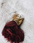 Granada Hotel Signature Tassel Keychain solid brass keychains burgundy silk tassel Nomada Signature for Granada San Luis Obispo by Nomada Deco